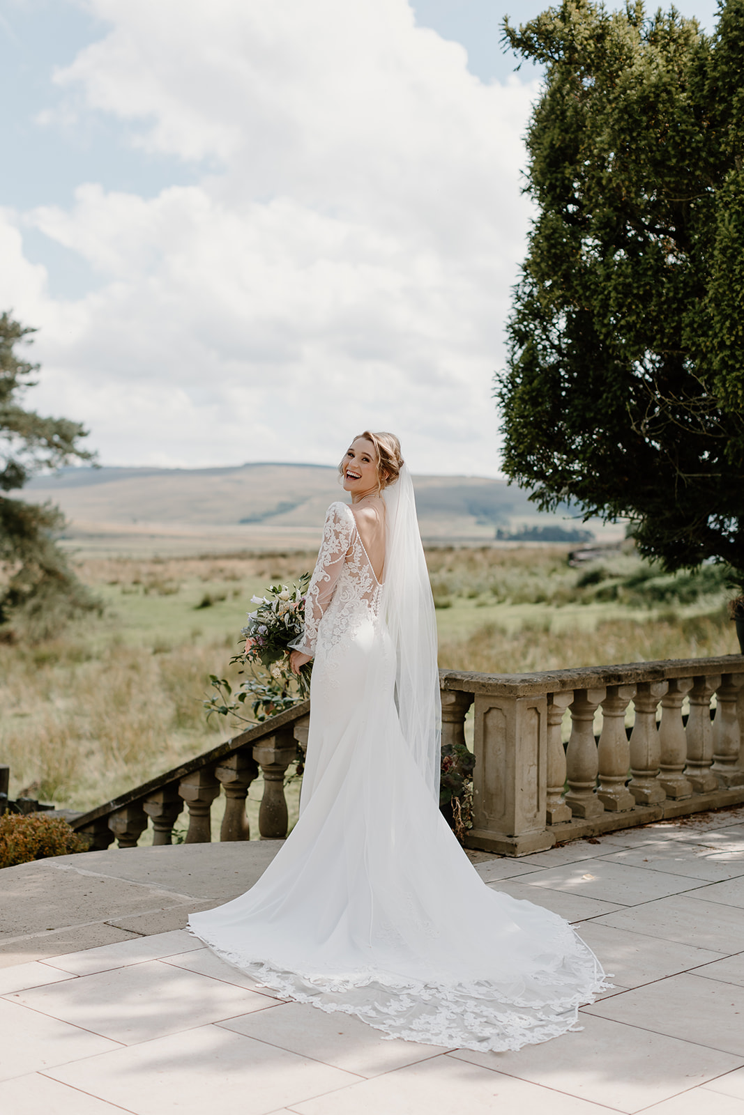 Bride In Crepe Wedding Dress With Lace Sleeves Called Nikki By Maggie Sottero