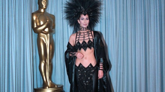 Cher In Iconic Black Oscars Dress With Head Dress