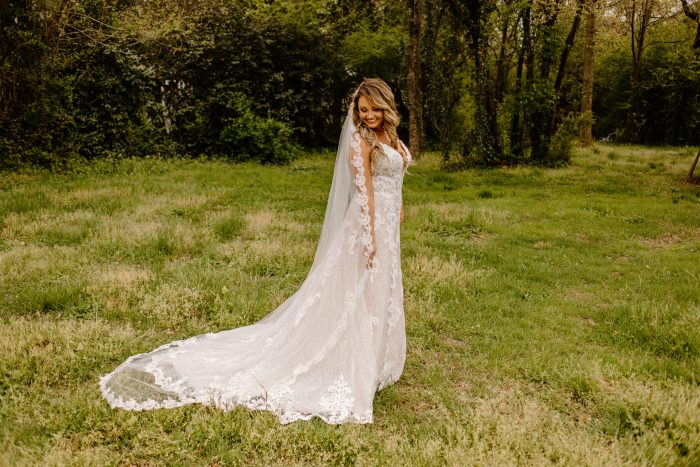 Bride In Lace Wedding Dress With Sleeves Called Tuscany Lane By Maggie Sottero