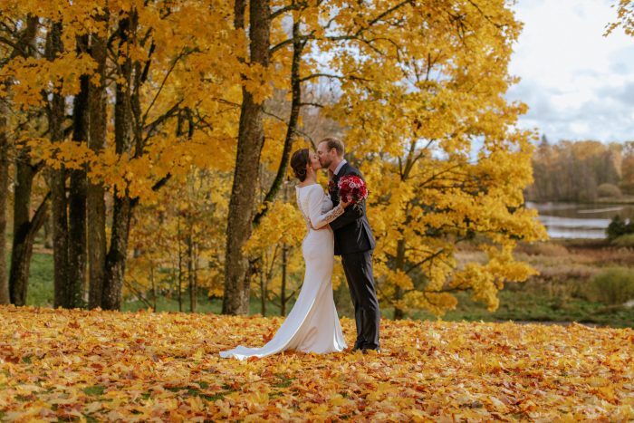 Bride In Long Sleeve Crepe Wedding Dress Called Aston By Sottero And Midgley In Autumn