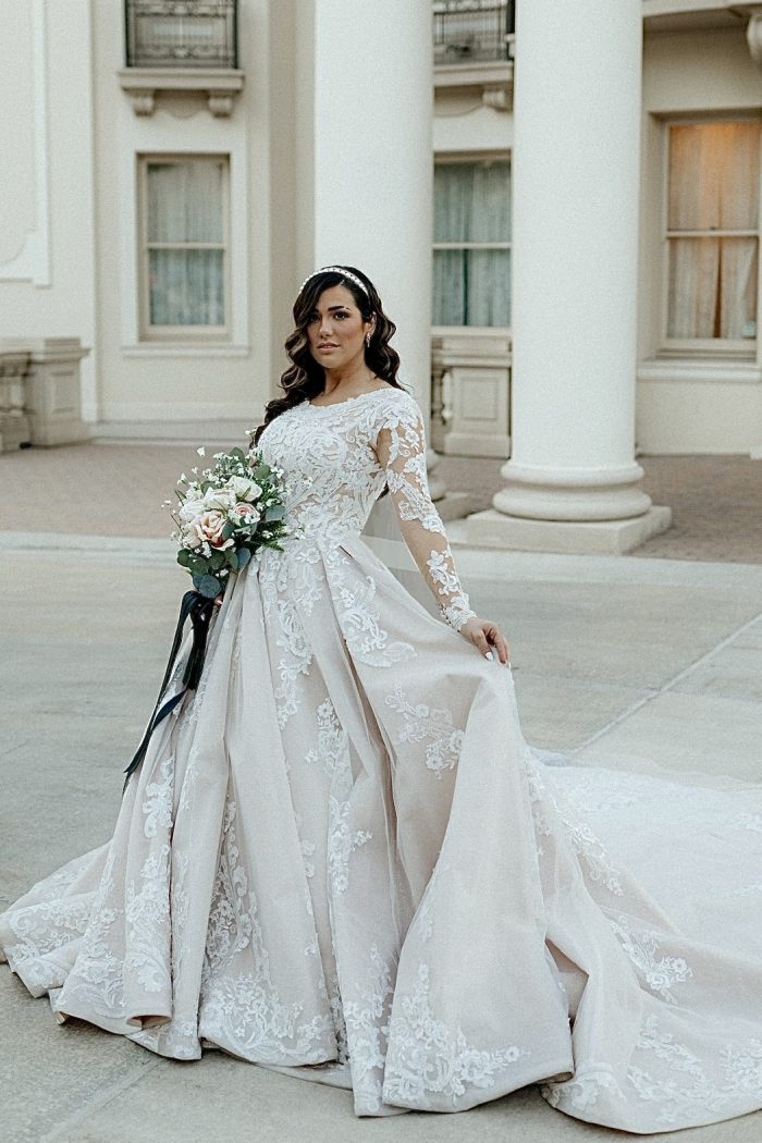 Bride Posing with Bridal Bouquet Wearing Ballgown Norvinia Lynette Wedding Dress by Sottero and Midgley