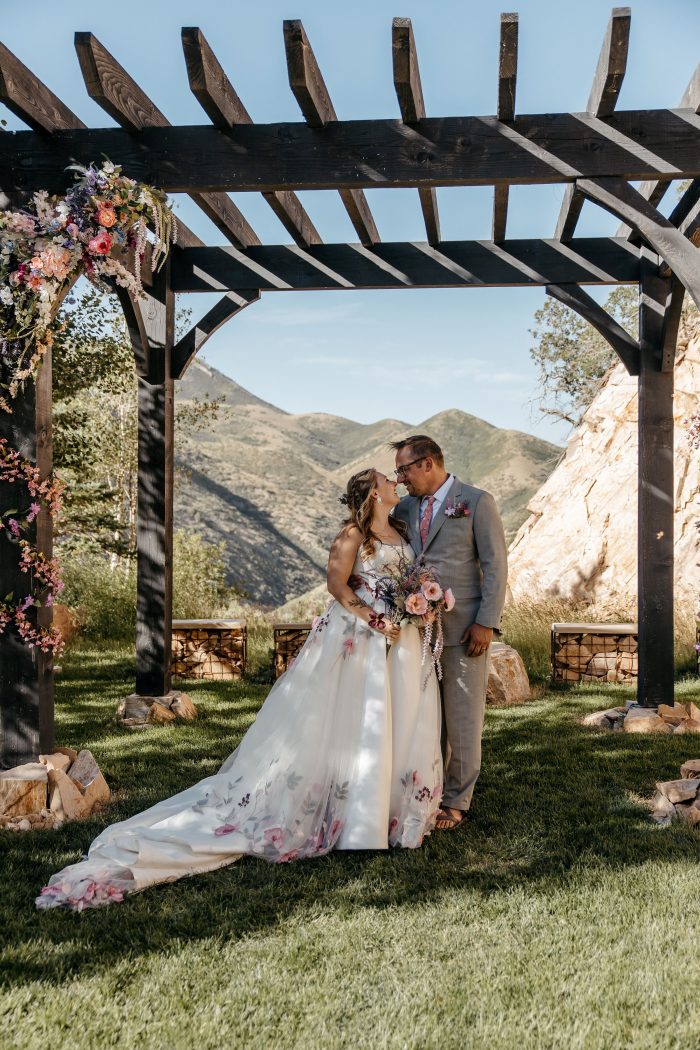 Bride In Wedding Dress With Detachable Train Called Lavinia By Maggie Sottero With Floral Wedding Aesthetic