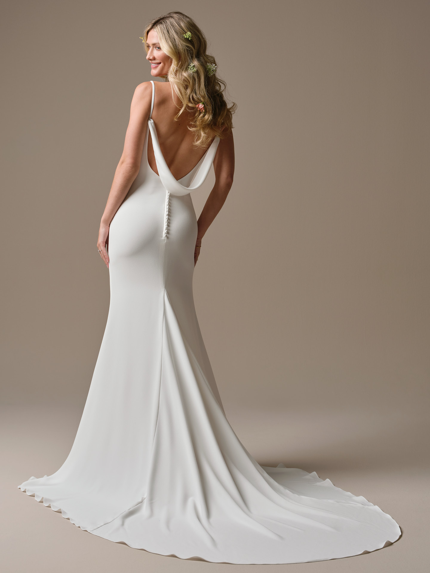 Rebecca Ingram Brenda wedding dress back view with a low draped cowl back, covered button detailing, and a soft flowing train for a romantic yet understated finish