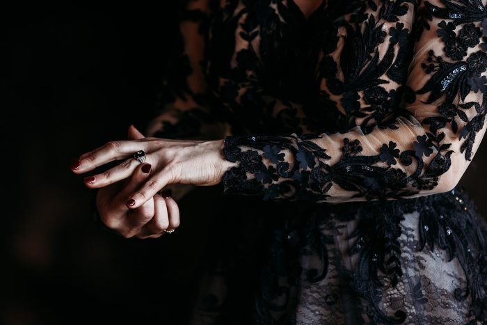 Photo Of Bride In Long Sleeve Black Wedding Dress With Unique Engagement Ring Styles