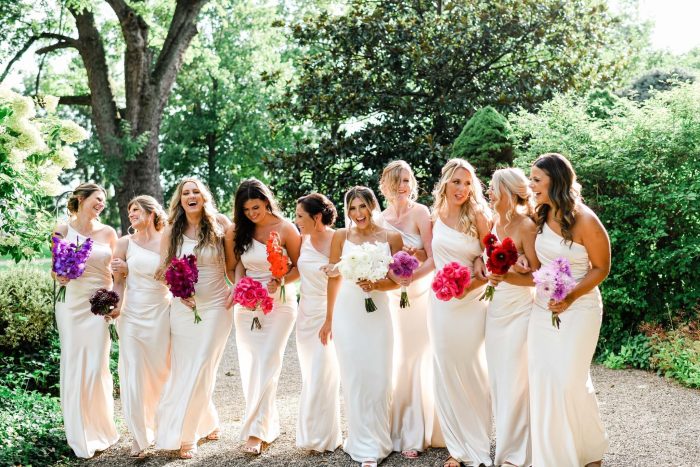 Bride In Sexy Sheath Wedding Dress Called Alberta By Maggie Sottero With Bridesmaids In White With Magenta Florals