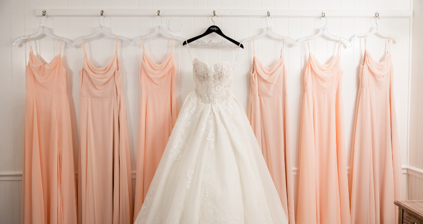 Bridesmaids dresses in the Pantone Color of the Year 2024, Peach Fuzz.