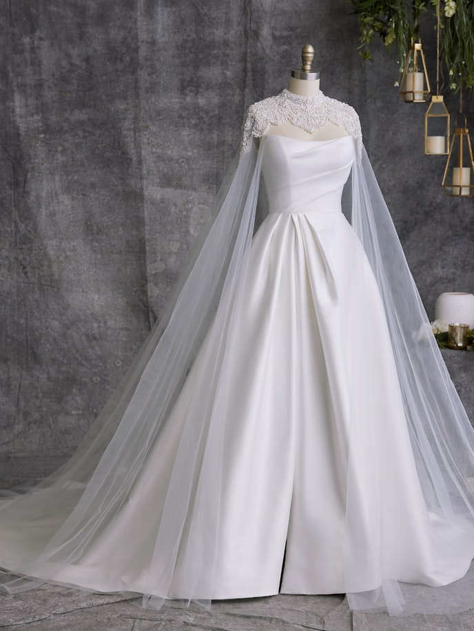 Mannequin In Satin Wedding Dress Called Aspen By Sottero And Midgley With Cape Called Clark 