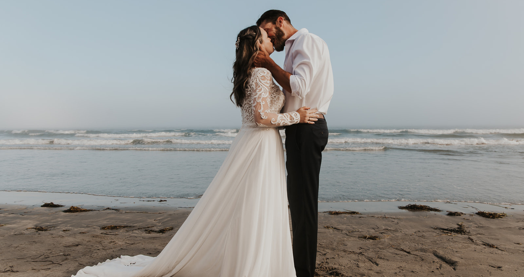 Bride In Casual Wedding Dresses Called Lorraine Dawn By Rebecca Ingram With Husband On Beach
