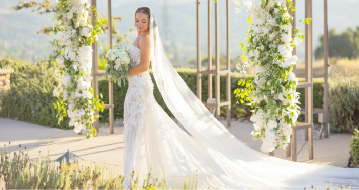 Bride wearing one of our floral wedding dresses called Nyjah by Maggie Sottero at her spring wedding