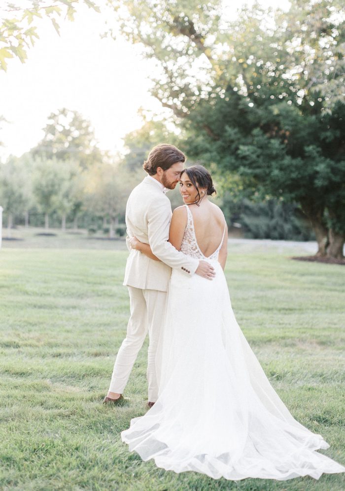 Bride In Crepe Wedding Dress With Overskirt Called Carmen By Rebecca Ingram