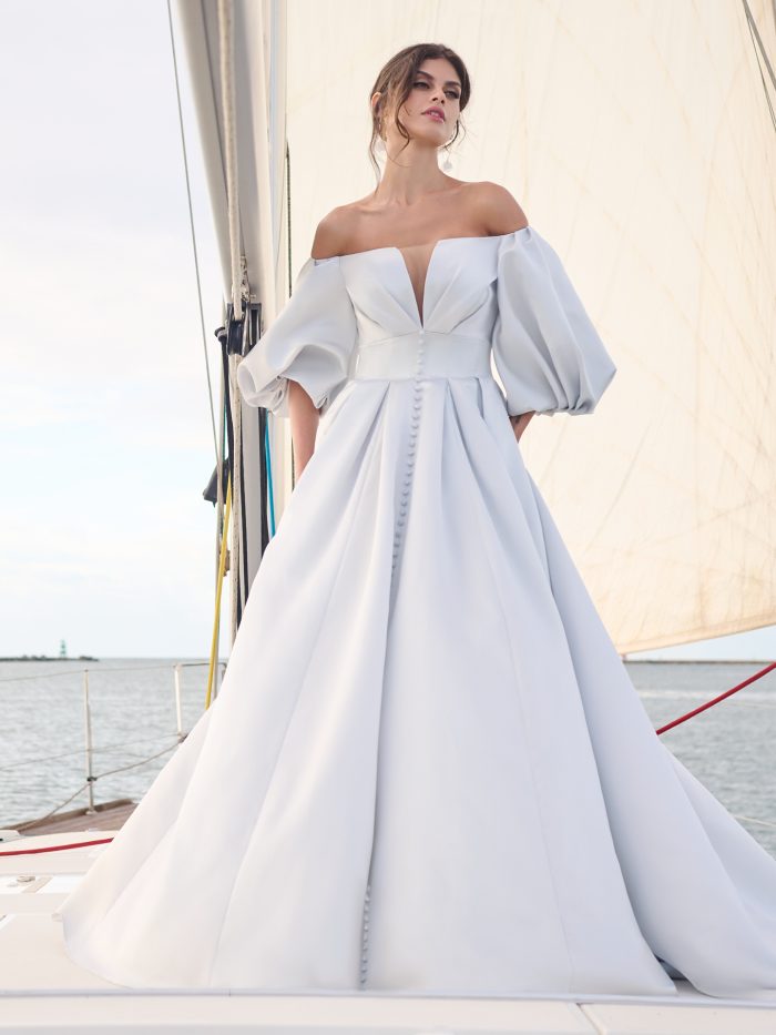 https://maggieblogassets.sfo2.digitaloceanspaces.com/wp-content/uploads/2023/05/Sottero-and-Midgley-Juniper-Ball-Gown-Wedding-Dress-23SW717A01-PROMO1-BL-700x933.jpg