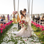 Bride In Barbiecore Wedding Dress With Pink Accents And Groom