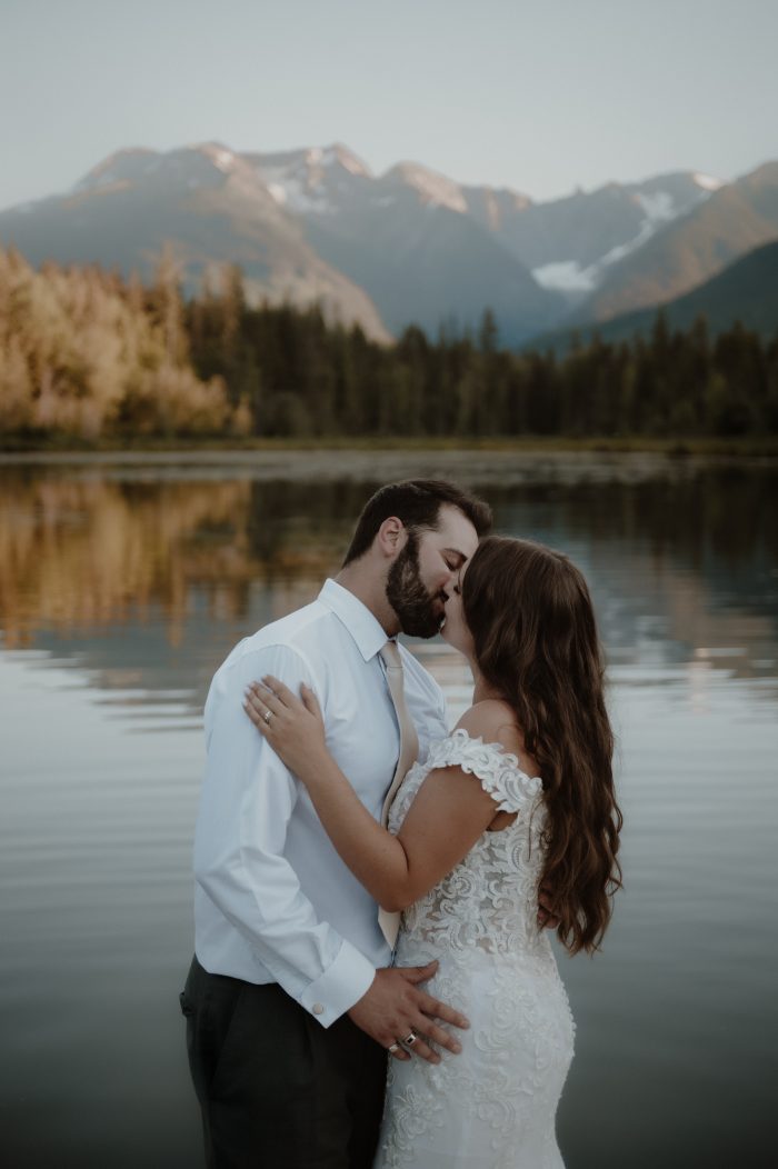 Bride wearing Edison by Maggie Sottero and kissing her husband