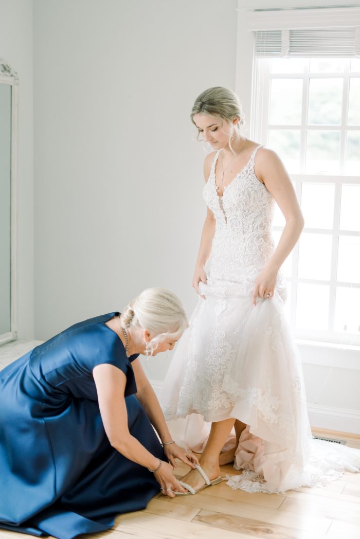 Bride in her wedding shoes wearing Johanna gown by Maggie Sottero