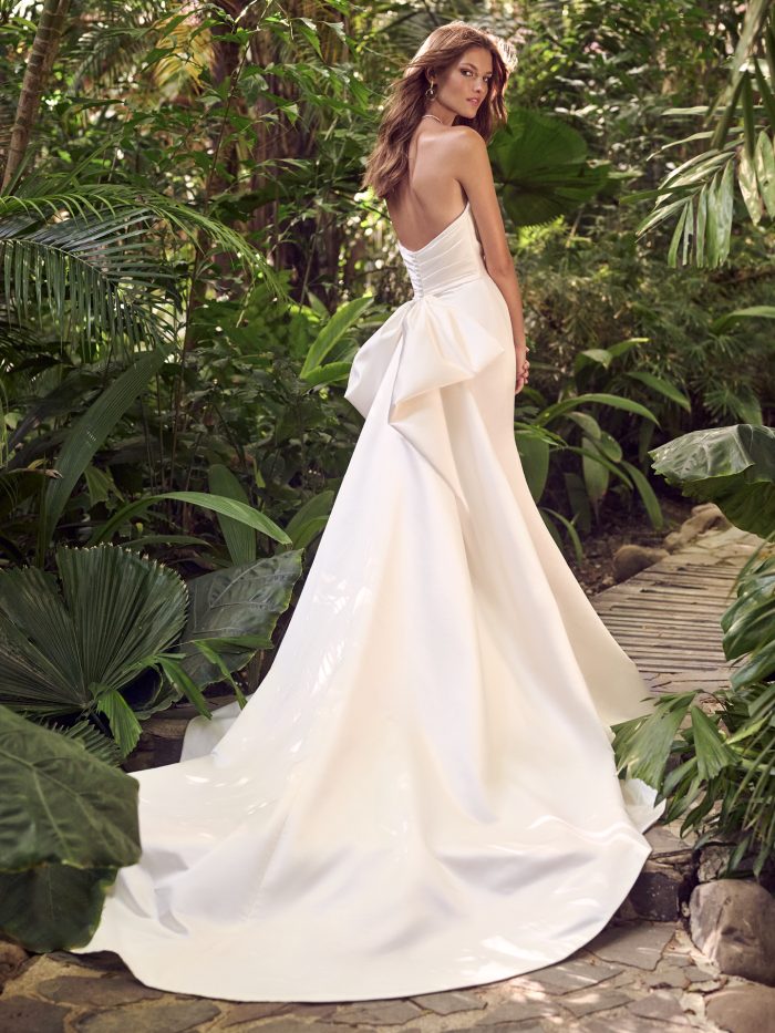 Bride from Back Wearing Simple fit-and-flare low-impact fabric bridal dress Hilo Marie by Maggie Sottero, made of recycled materials