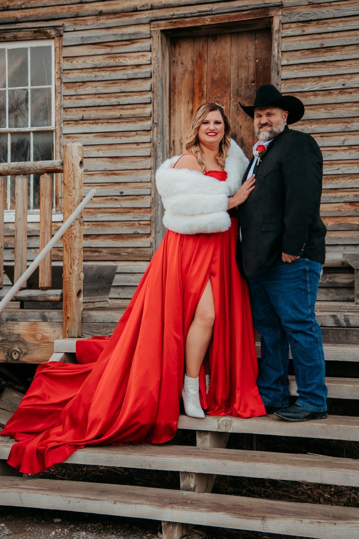 Bride wearing boots as her wedding shoes in Scarlet wedding gown by Maggie Sottero