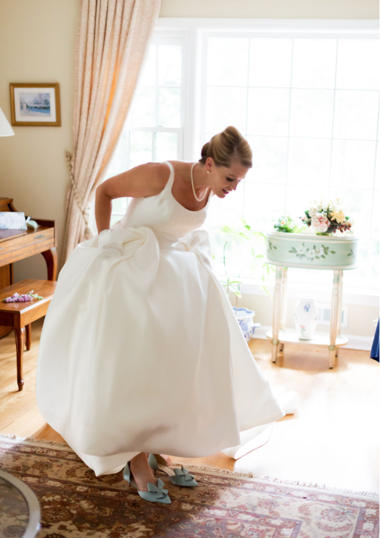 Bride wearing colorful wedding shoes in Selena wedding dress by Maggie Sottero