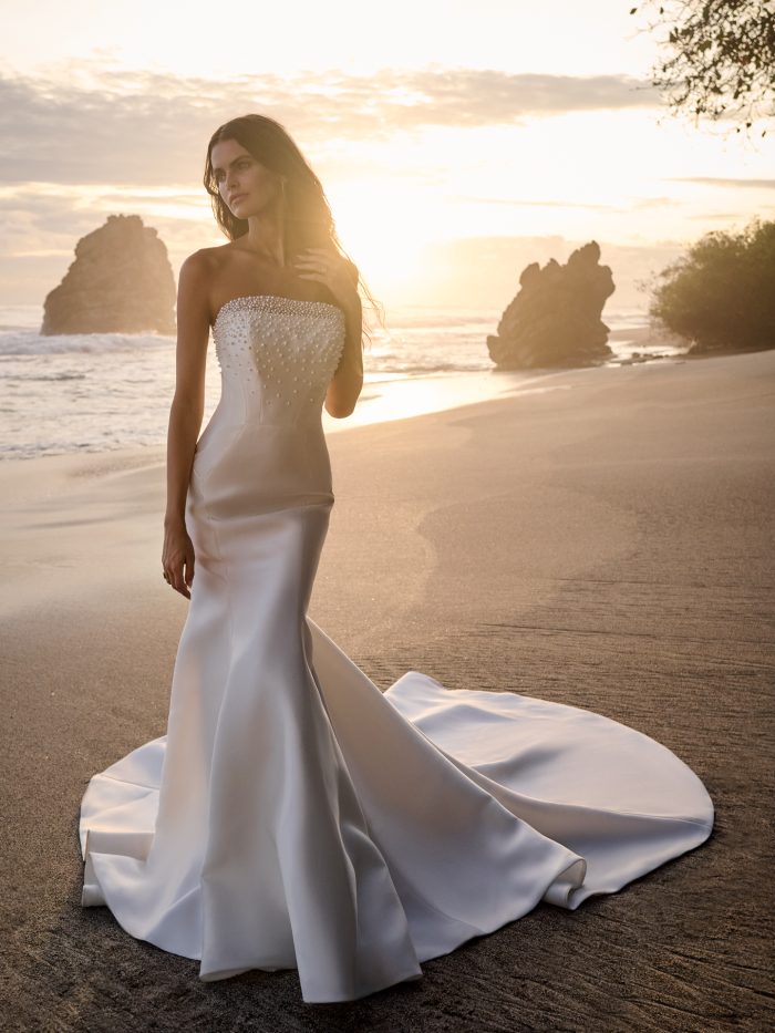 Bride Walking on Beach in Pearl Fit and Flare Lower Impact Material Wedding Dress Jasper by Sottero and Midgley, made of recycled materials