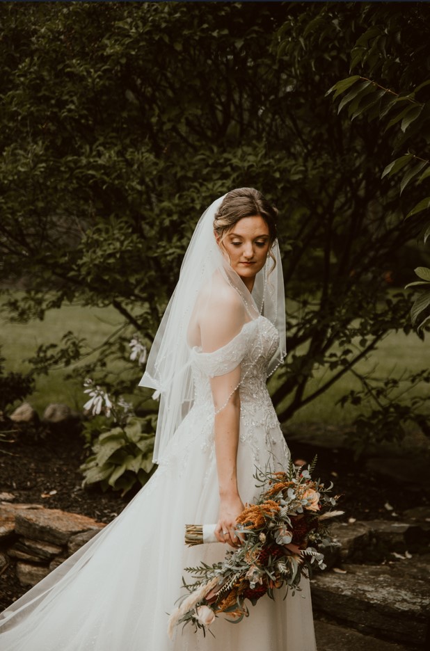 Bride wearing Artemis sparkly wedding dress by Maggie Sottero