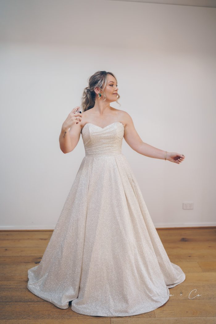 Bride wearing Anniston ballgown by Maggie Sottero