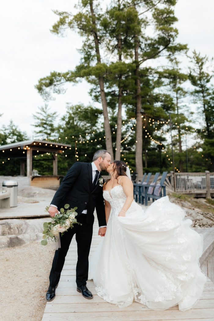 Bride wearing Casey sparkly wedding dress by Maggie Sottero and groom