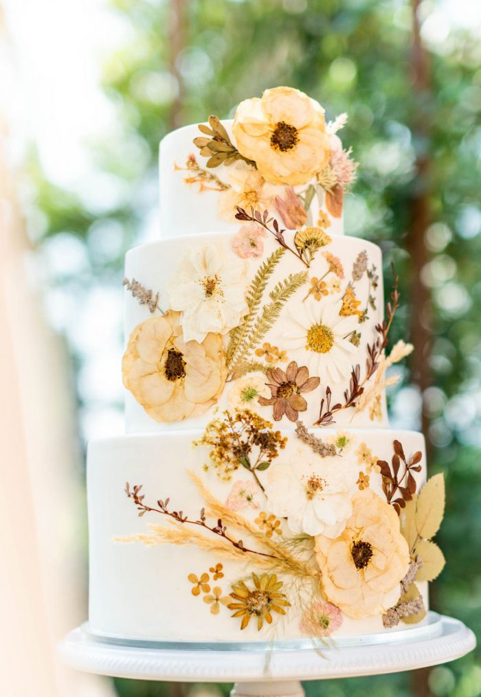 Pressed flowers on wedding cake