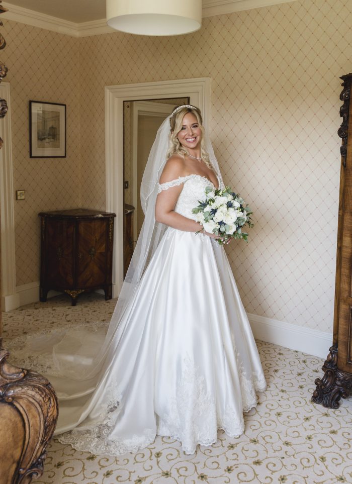 Bride wearing Kimora wedding gown by Sottero and Midgley, which goes well with winter wedding themes