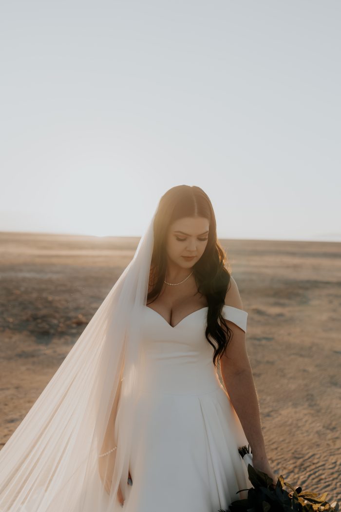 A bride wearing Kyrie by Maggie Sottero, one of our wedding dresses with pockets