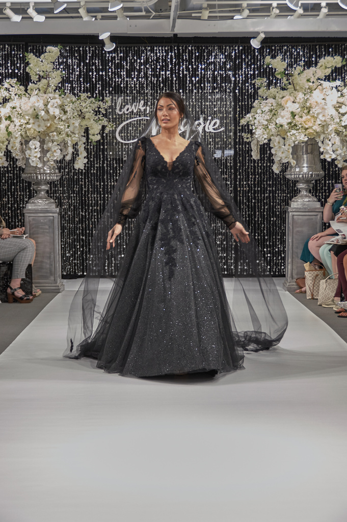 Model wearing Alexandria gown by Rebecca Ingram in black