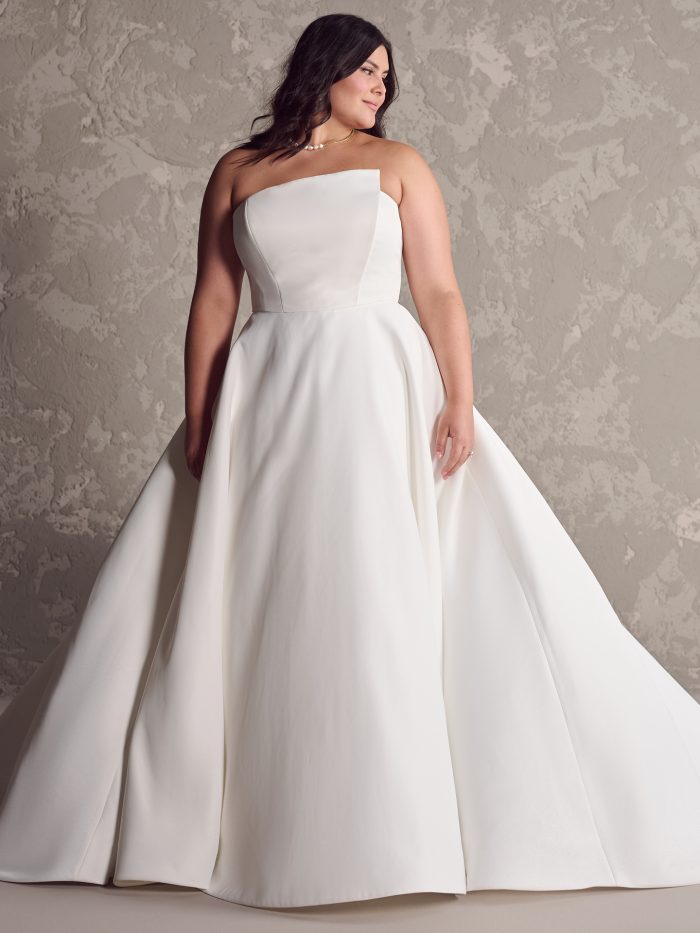 Bride wearing plus size wedding dresses like Ambrose by Maggie Sottero