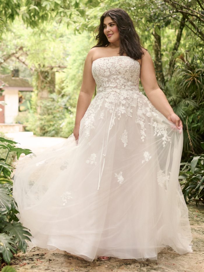Bride wearing plus size wedding dresses like Avalon by Maggie Sottero