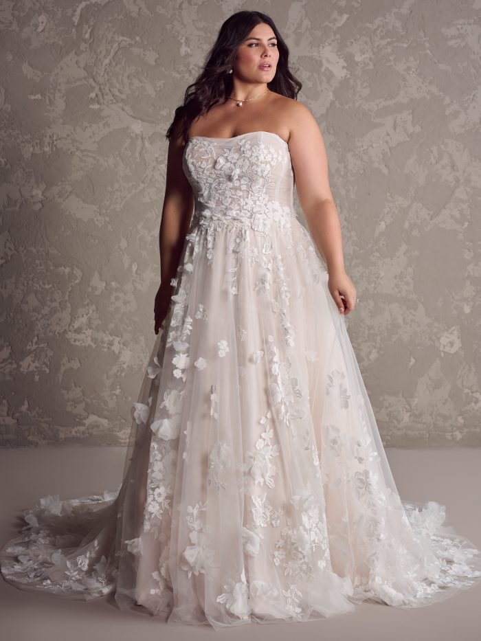 Bride wearing plus size wedding dresses like Laila by Maggie Sottero