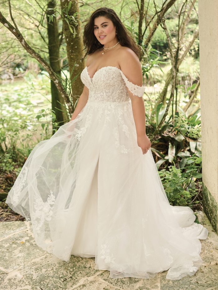 Bride wearing plus size wedding dresses like Marguerite by Maggie Sottero