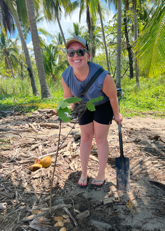 A Maggie Sottero team member planting a tree through our partnership with One Tree Planted