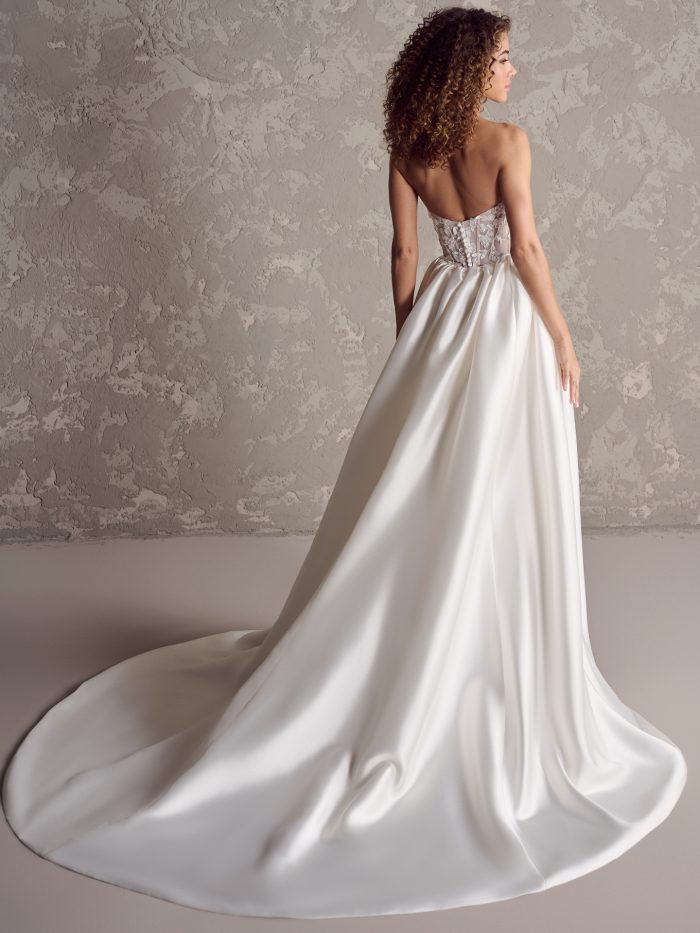 Back of a bride wearing Twyla wedding gown by Rabecca Ingram