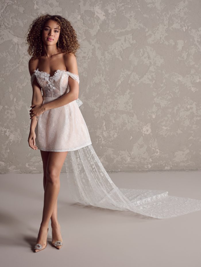 Model wearing wedding bow dress Zoe by Rebecca Ingram