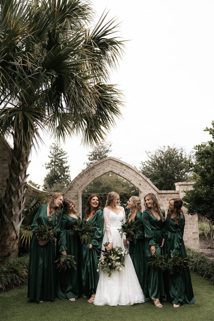 Bride with her bridesmaids wearing Seneca wedding gown by Sottero and Midgley, which goes well with winter wedding themes