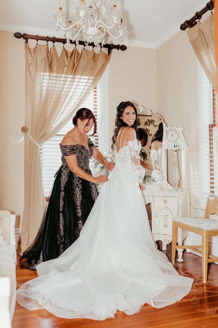 Bride wearing Stevie sparkly wedding dress by Maggie Sottero
