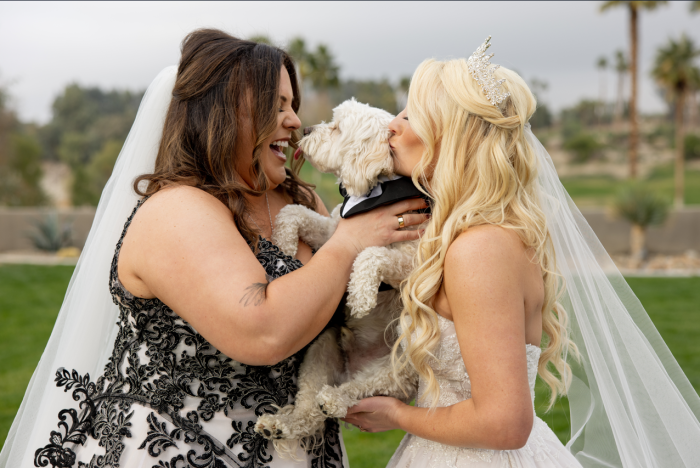 Katie and Curly with their dog, Curly wearing Tristyn by Maggie Sottero