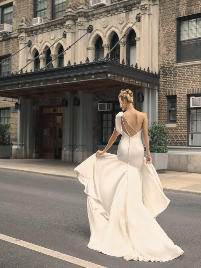 Model wearing wedding bow dress Saratoga by Maggie Sottero