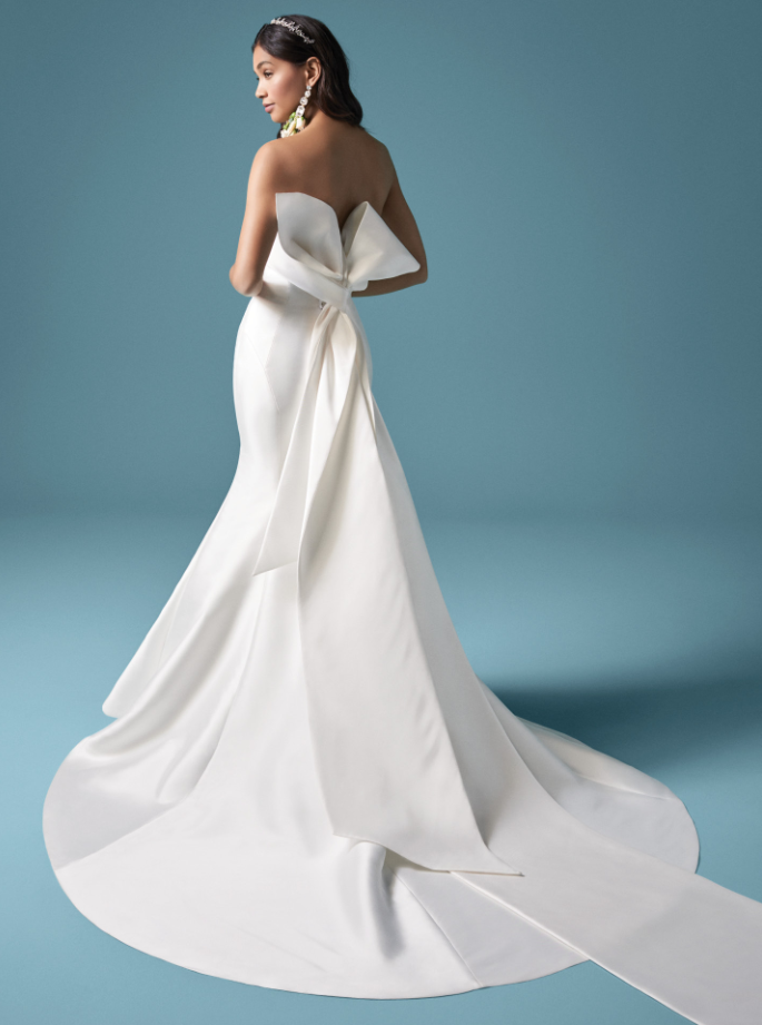 Model wearing Mitchell destination wedding dress by Maggie Sottero