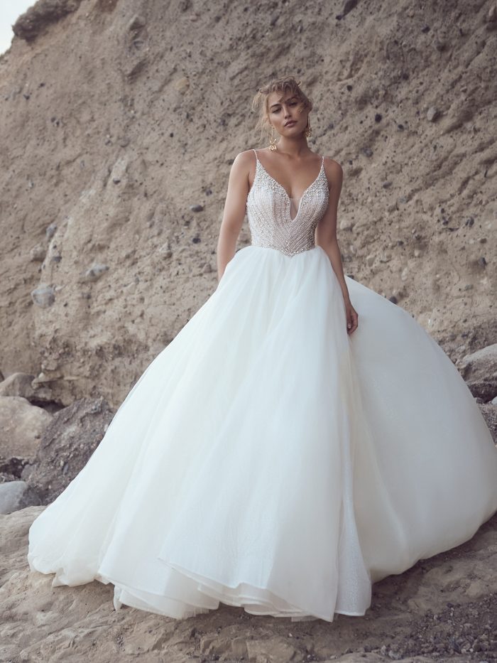 Bride wearing Bannock wedding gown by Sottero and Midgley that pairs well with cushion engagement rings