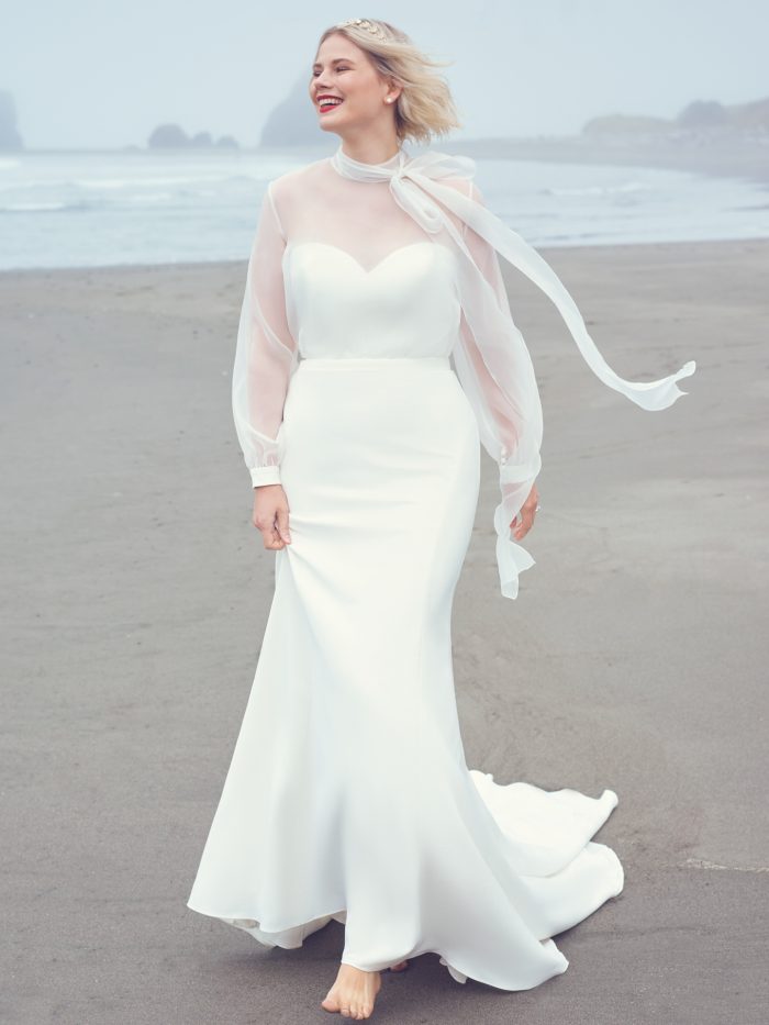 Model wearing wedding bow dress Lupita by Sottero and Midgley