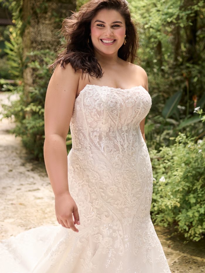 Bride wearing plus size wedding dresses like Norvinia Lane by Sottero and Midgley