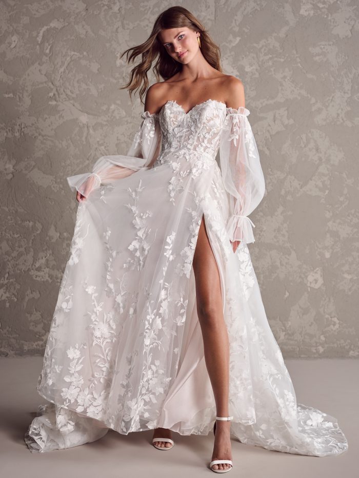Bride wearing Sutton off-the-shoulder wedding dress by Sottero and Midgley