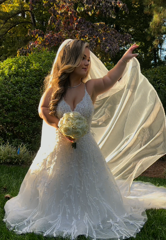 Lona wearing one of Sottero and Midgley's A-line wedding dresses, Marvine