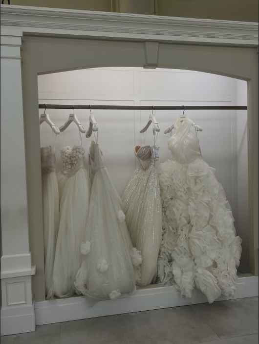 Wedding shopping tips: dresses on the display at a bridal shop