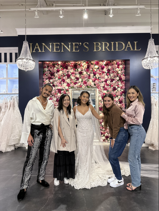 Bride wedding dress shopping with her family
