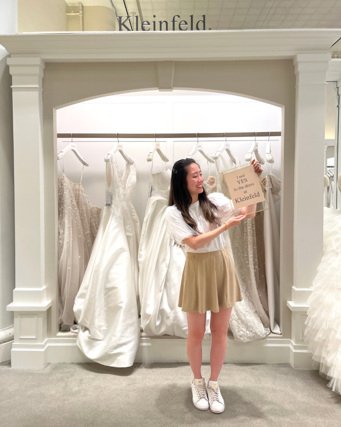 Bride saying yes to her dress while wedding dress shopping