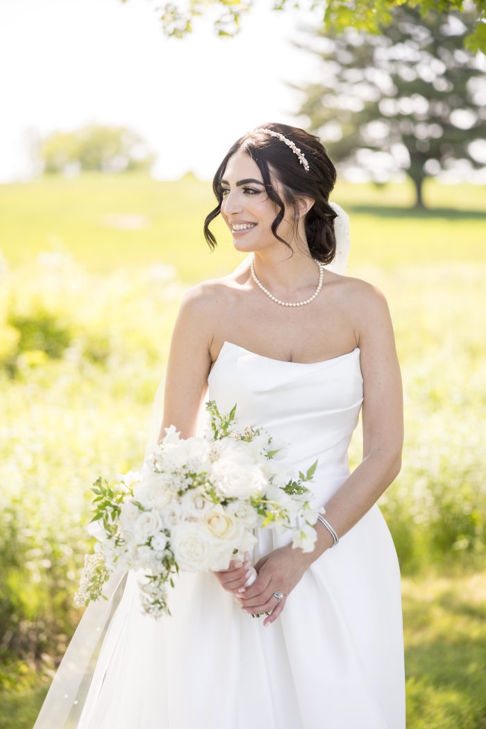 Bride wearing Aspen wedding dress by Sottero and Midgley